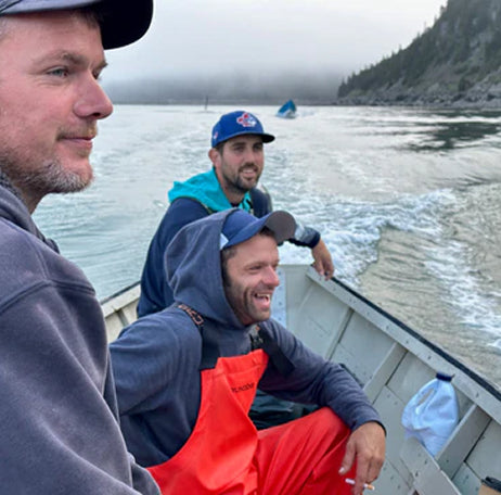 Gallery page image 4 featuring the Dark Harbour harvest crew traveling by boat on the Bay of Fundy